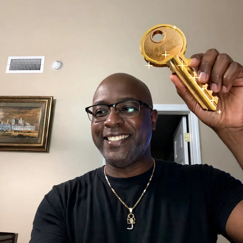 Theoda Metcalf holding a gold key